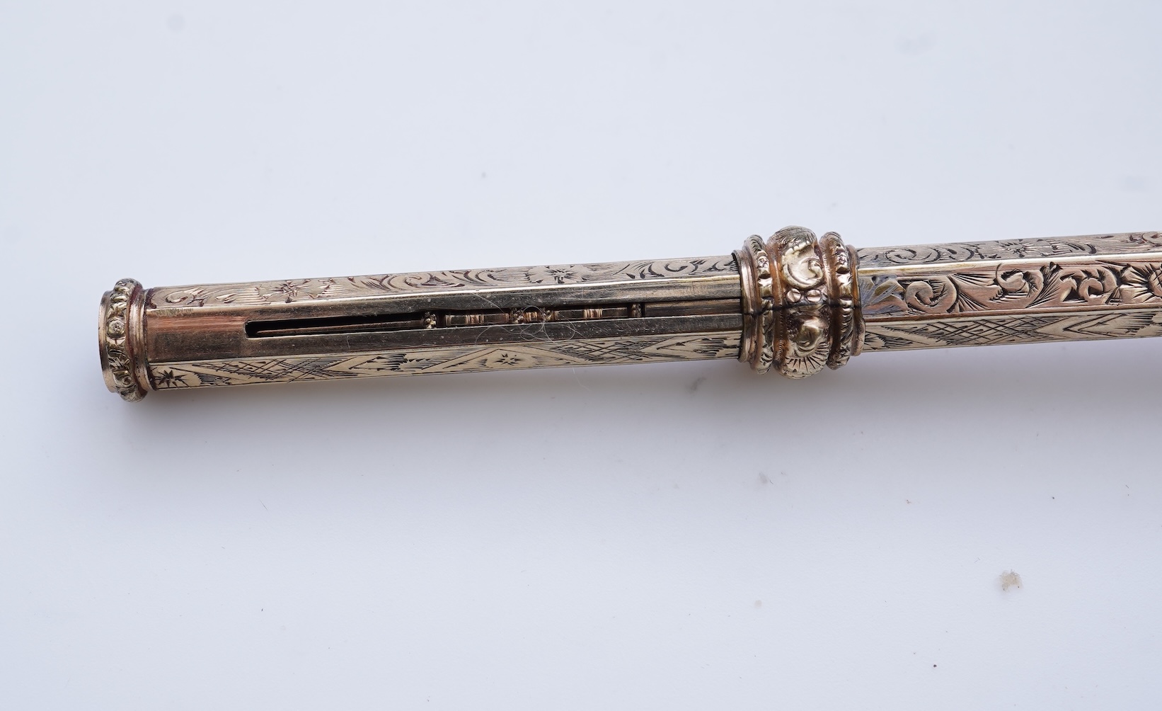 An early Victorian gold and amethyst mechanical pencil, mid 19th century
